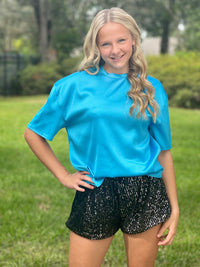 These stunning shorts are designed to make a statement and turn heads at any event. The sequin detailing adds a touch of sparkle and allure, perfect for those who love to shine.  Black sequin shorts Elastic waist band