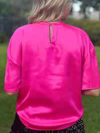 Prepare to dazzle in our Hot Pink Satin Top - a stunning fusion of vivacity and elegance that's perfect for making a bold and unforgettable style statement.